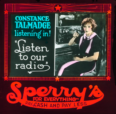 Constance Talmadge featured in generic advertising slide, localized to endorse Sperry's retail.