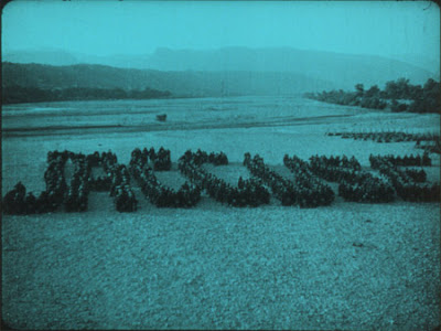 Opening title from J'Accuse spelled out using soldiers on leave from the front lines.
